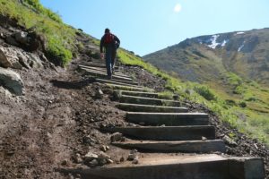 Climbing some of the stairway at Flattop Mountain